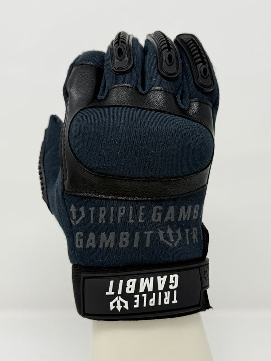 Black tactical glove with 'Triple Gambit' branding on a white background